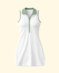 White sleeveless dress with green accents on a light beige background