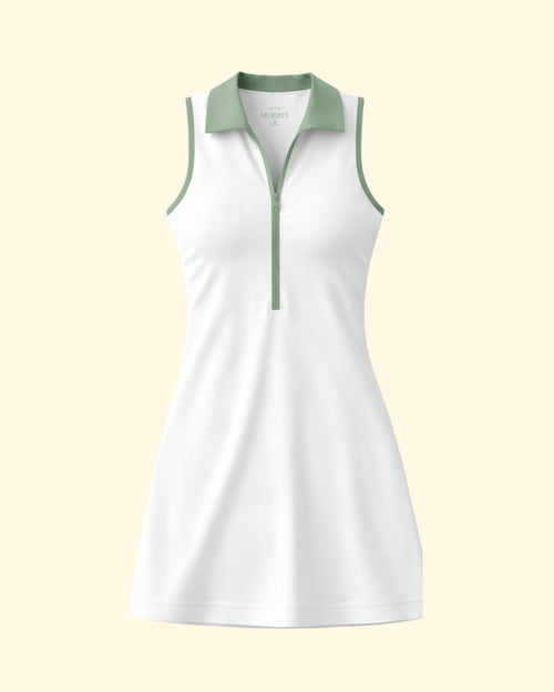 White sleeveless dress with green accents on a light beige background